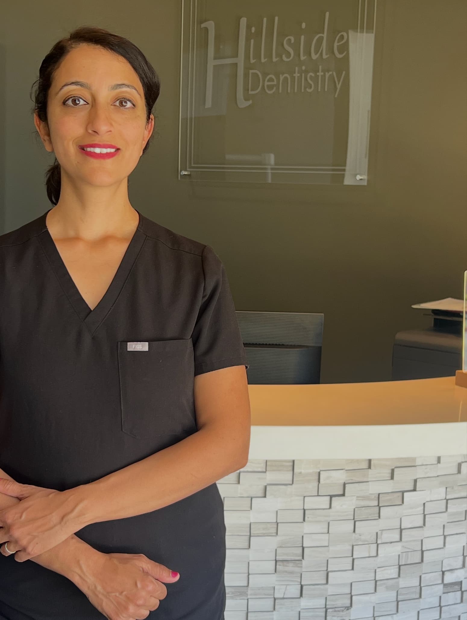 Dr. Marise Sheth, DDS at the Hillside Dentistry & Orthodontics front desk — Torrance, CA